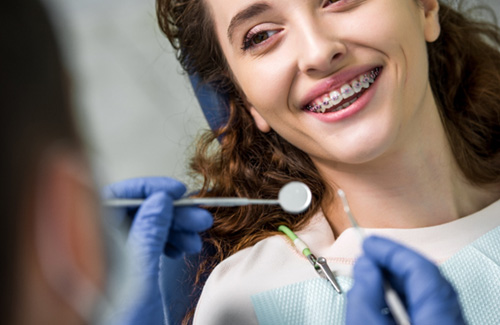 A model showing various bite misalignment issues corrected by braces 