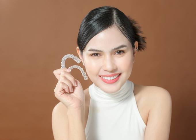 Lady shows off Invisalign clear aligners