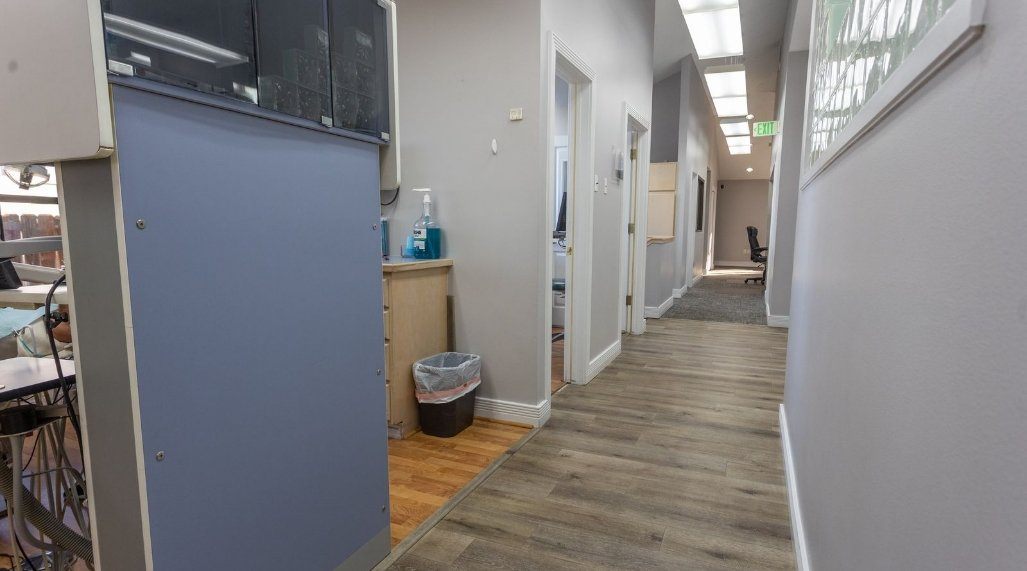 Hallway branching off into several dental treatment rooms