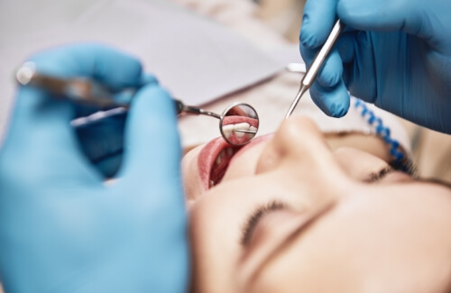 Dentist giving a patient a dental exam